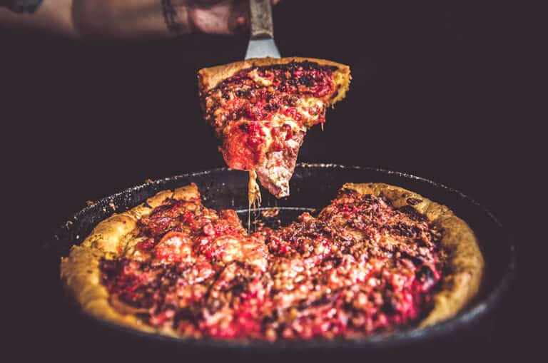 Deep Dish Meat Lovers Pizza being served